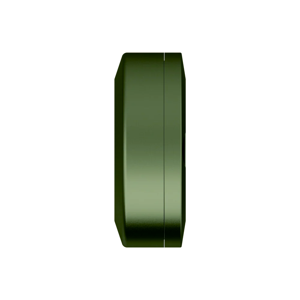 Green nicotine pouch metal travel container, showing the side of the can